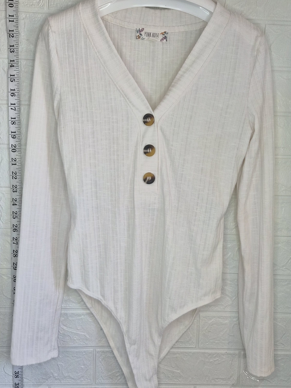 Pink Rose White Ribbed V‑Neck Henley Bodysuit with Tortoiseshell Buttons